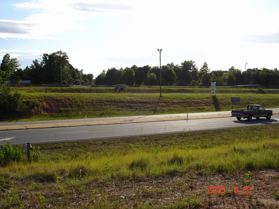 view from hwy 115 / charlotte hwy on the opposite side of road. this photo is taken across the street from the property on this side of the road is arbys restaurant, convenience store and gas station.
